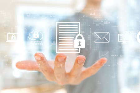 Data protection concept with young man holding his handの写真素材