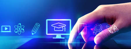 E-learning concept with hand pressing tablet computer screenの写真素材