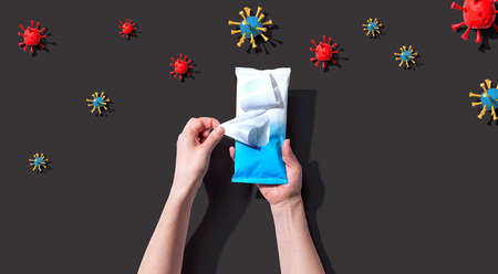 Sanitizer wipe with coronavirus concept - flat lay