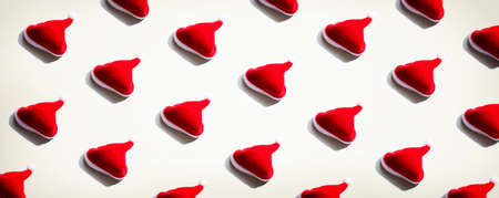 Pattern of small santa hats - overhead view flat layの写真素材