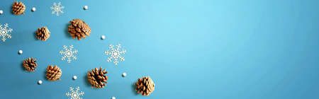 Christmas pine cones with snow flakes - flat lay