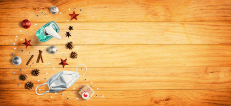 Christmas ornaments with a mask and a sanitizer bottle from aboveの写真素材