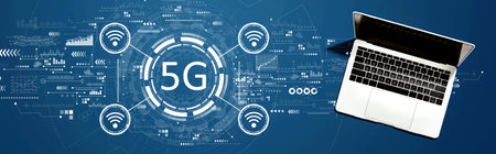 5G network with a laptop computer on a deskの写真素材