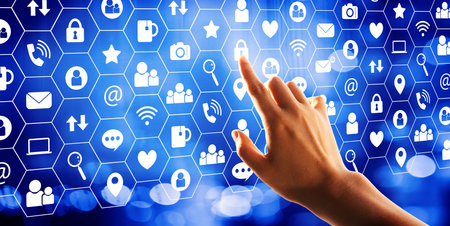 Social media theme with hand pressing a button on a technology screen