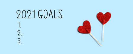2021 goals with red glitter heart picks - flat layの写真素材