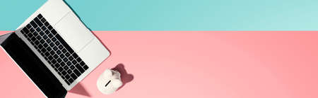 Laptop computer with piggy bank - flat layの写真素材