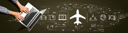 Flight ticket booking concept with person using a laptop computerの写真素材