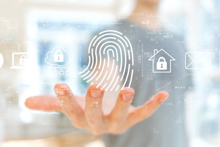 Fingerprint scanning theme with young man holding his handの写真素材