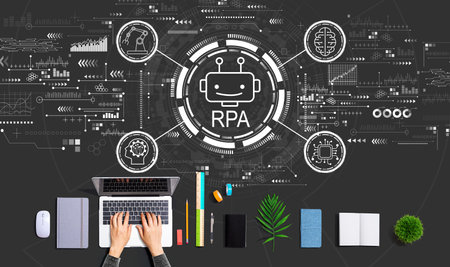 Robotic Process Automation theme with person using a laptopの写真素材
