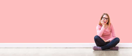 Young woman thinking about somethingの写真素材