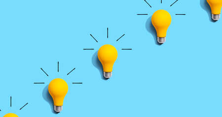 Yellow light bulb pattern with shadow