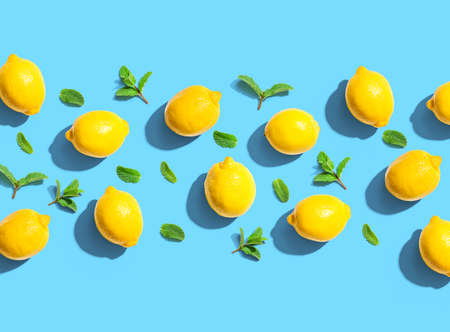 Fresh yellow lemons with mints overhead viewの写真素材