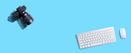 Computer keyboard with a SLR cameraの写真素材