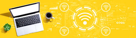 Wifi theme with a laptop computerの写真素材