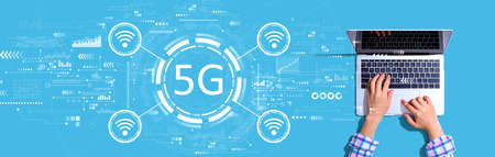 5G network with person using a laptopの写真素材