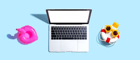 Laptop computer with summer theme itemsの写真素材