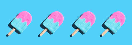 Pink and blue ice pop with shadowの写真素材
