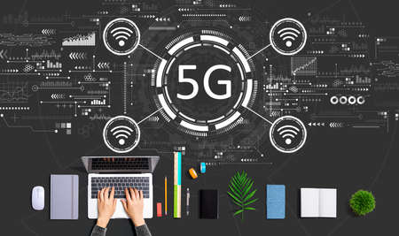 5G network with person using a laptopの写真素材