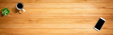 Smartphone with a coffee mug and succulent plantの写真素材