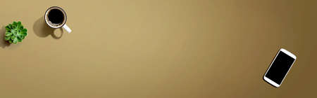 Smartphone with a coffee mug and succulent plantの写真素材