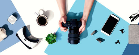 Person holding a SLR cameraの写真素材