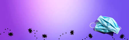 Facial masks with small black spidersの写真素材