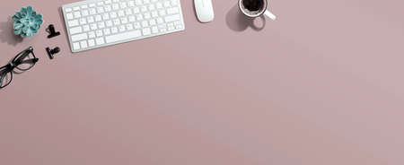 Computer keyboard with a cup of coffee and eyeglassesの写真素材