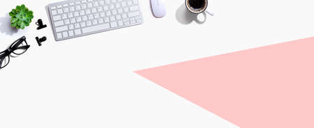 Computer keyboard with a cup of coffee and eyeglassesの写真素材