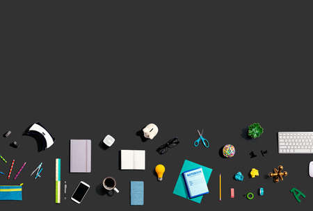 Collection of electronic gadgets and office suppliesの写真素材