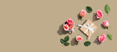 Gift box with pink roses overhead view