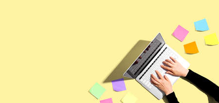 Laptop computer with many sticky notes