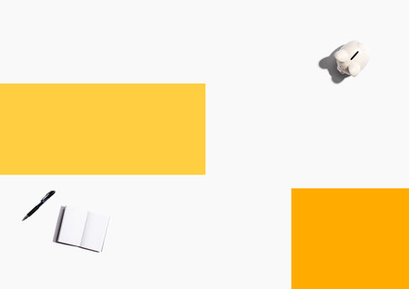 Piggy bank with a notebookの写真素材