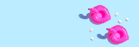 Summer concept with pink flamingo floats