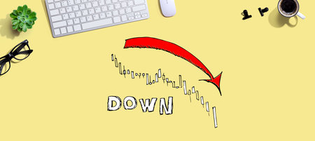 Market down trend chart with a computer keyboard