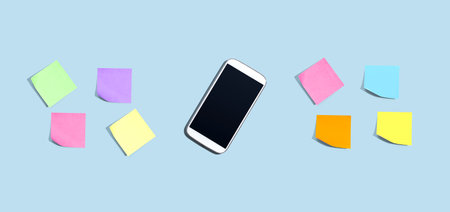 Smartphone with many colurful sticky notes from above