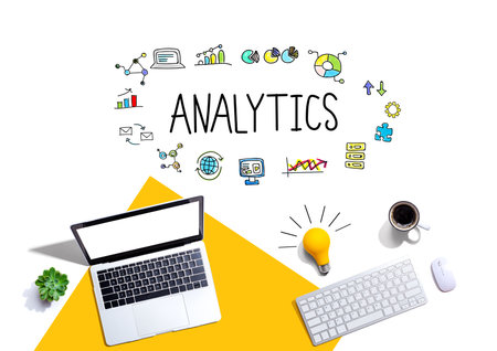 Analytics theme with computers and a lightbulbの写真素材