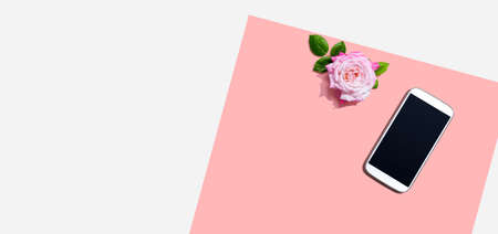 Smartphone with a pink rose