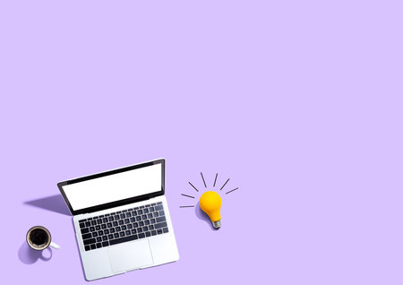 Computers with a light bulbの写真素材