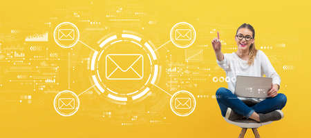 Email concept with young womanの写真素材