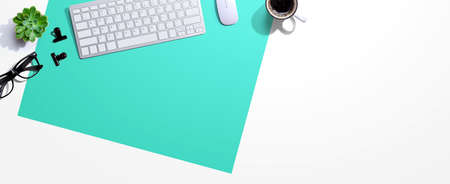 Computer keyboard with a cup of coffee and eyeglasses