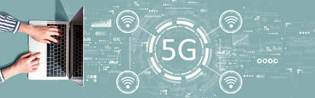 5G network with person using a laptopの写真素材