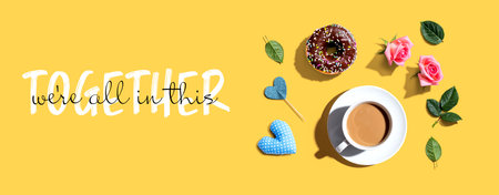 We are All in This Together message with a cup of coffee and a donutの写真素材