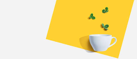 Shamrock leaves with coffee cup