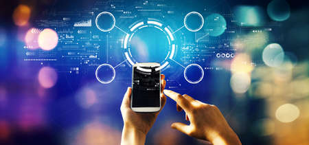 Tech circle with person using a phoneの写真素材
