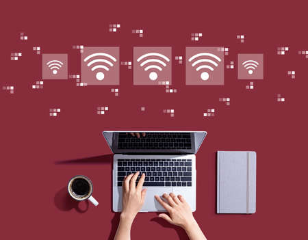 Wifi concept with person using a laptopの写真素材