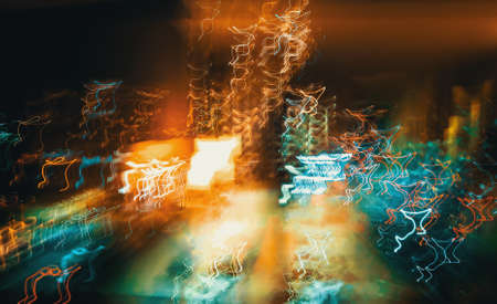 Abstract blurred cityscape neon lights backgroundの写真素材