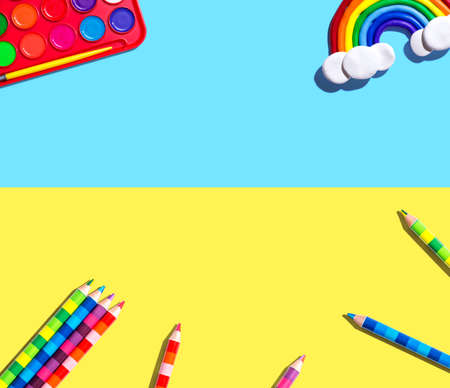 Art supplies with a rainbow - flat layの写真素材
