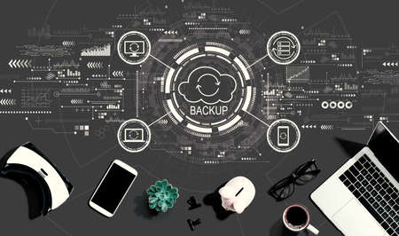 Backup concept with electronic gadgets and office suppliesの写真素材