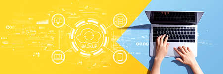 Backup concept with person using a laptop