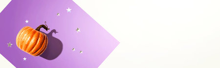 Orange pumpkin with silver starsの写真素材